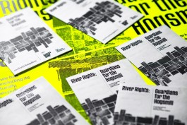 River rights Booklets. Close-up of several folded black-and-white booklets titled River Rights: Guardians for the Hogsmill, arranged over a vibrant neon yellow event poster. The booklets feature a woven river graphic and bold typography, promoting a curated dinner and exhibition at Stanley Picker Gallery addressing river rights and environmental justice.