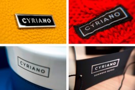 Cyriano Dogwear Outfit logo closeup. Reproduced in different techniques (metal, embroidery, serigraphy, hot foil). Branding & Identity.