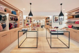 General front view of the Cyriano Dogwear Outfit flagship store with display units, shelves full of clothes and accessories. Photography, Branding & Identity.