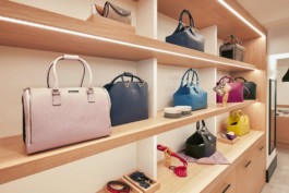 Wooden shelves displaying Cyriano Dogwear Outfit leather bags inside the flagship store. Photography, Branding & Identity.